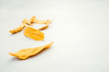 Dried mango slices on a white background. selective focus.