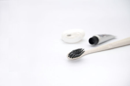 Toothbrush and toothpaste on white background. Dental care concept.
