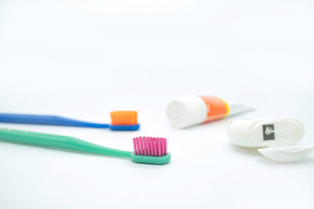 Toothbrush and dental floss on white background. dental careの写真素材