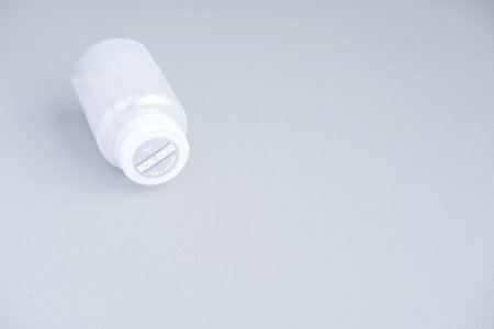 White plastic bottle on a white background. close-up shot.の写真素材