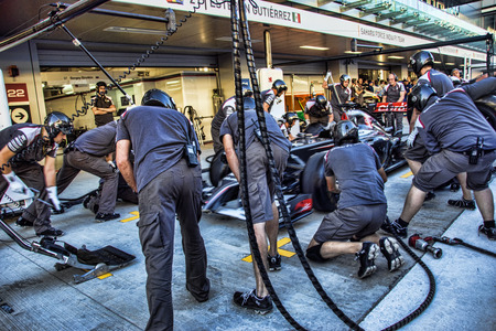 Sochi Autodrom. Grand Prix of Russia. Formula One  Sauber Race Car pitstop â team mechanics.: Esteban Manuel GutiÃ©rrez GutiÃ©rrez race car in paddock.Photo taken on:  	October 9th, 2014のeditorial素材