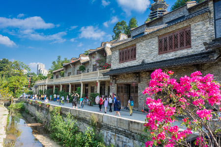 A lot of tourists spending a vacation at the traditional Chinese Hakka village in Shenzhen, Chinaのeditorial素材