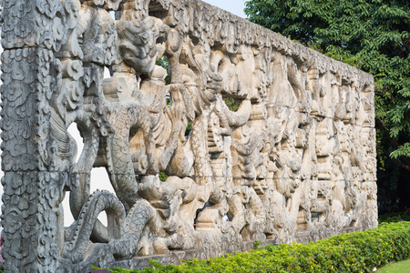 Chinese dragon culture - Chinese dragon carved in the stone wall in Shenzhen, Chinaの写真素材