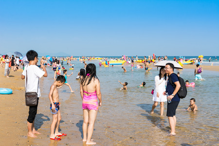 A lot of tourist swimming at the Hailing island of Yangjiang during the long holiday of China National Day.のeditorial素材