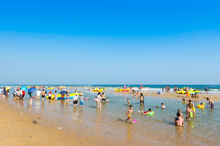 A lot of tourists on vacation at the Hailing island of Yangjiang during the long holiday of China National Day.のeditorial素材