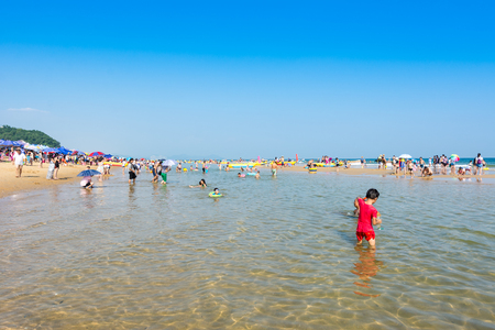 A lot of tourist swimming at the Hailing island of Yangjiang during the long holiday of China National Day.のeditorial素材