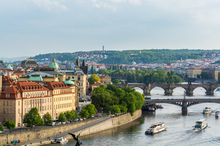 Aerial view of citycape of old town of Prague, with a lot of  rooftops, churches, and the landmark...