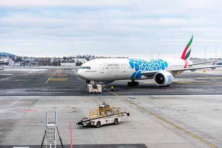 Planes in a snowy day in the International terminal of Oslo Gardermoen Airport  (OSL). the second-busiest airport in Scandinavia.のeditorial素材