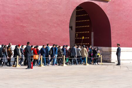 Long queue of tourists are waiting for passing throught the Tiananmen gate and entering the Forbidden City in Beijing, Chinaのeditorial素材