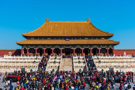 A lot of tourists entering the Taihe Palace, Hall of Supreme Harmony of the Forbidden City, the main buildings of the former royal palace of Ming dynasty and Qing dynasty in Beijing China.のeditorial素材