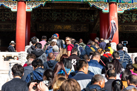 A lot of tourists entering the Taihe Palace, Hall of Supreme Harmony of the Forbidden City, the main...