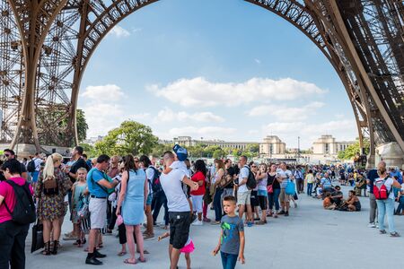 A lot of tourists at the ground floor of Eiffel Tower , a wrought-iron lattice tower on the Champ de Mars in Paris, France, named after the engineer Gustave Eiffel, constructed from 1887 to 1889.のeditorial素材