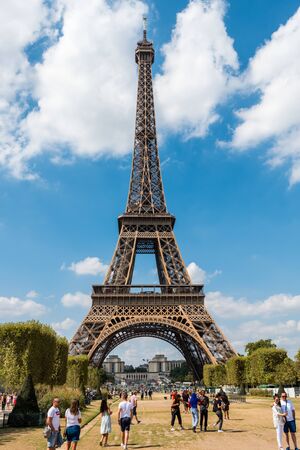 The Eiffel Tower against blue and cloudy sky, a wrought-iron lattice tower on the Champ de Mars in Paris, France, named after the engineer Gustave Eiffel, constructed from 1887 to 1889.のeditorial素材