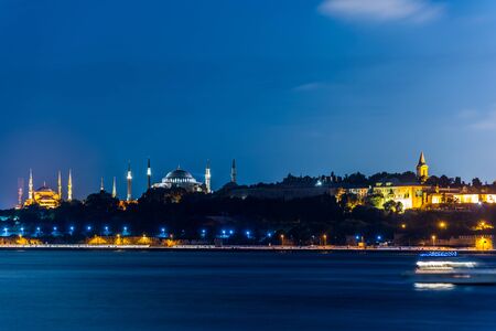 Beautiful night view of Bosphorus strait with Sultan Ahmed Mosque (blue mosque) and Hagia Sophia
mosque, View from Uskudar, Istanbul, Turkey, on the Anatolian shore of the Bosphorus.の写真素材
