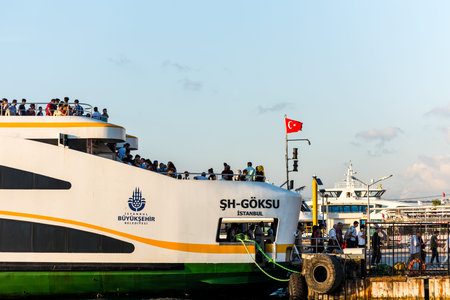 Cruise ship with a lot of passengers parking at the harbor of Uskudar, Istanbul, Turkey, on the Anatolian shore of the Bosphorus.のeditorial素材