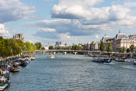 Beutiful view of Seine River with cruise ships and buildings, Paris, France.