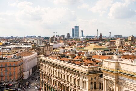 Aerial view of the old downtown of the Milan City with beautiful rooftops, view from the top of cathedral church of Milan, Lombardy, Italy.のeditorial素材