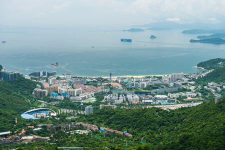 Buildings and sea at the costline of Shenzhen, view from the valley at Shenzhen Overseas Chinese Town East (OCT East) in Guangdong, Chinaのeditorial素材