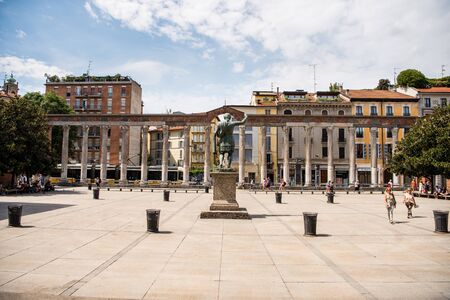 Monument To Roman Emperor Constantine I, in front of San Lorenzo Maggiore basilica, and ancient Porta Ticinese, one of the three medieval gates  in downtown of Milan, Italyのeditorial素材