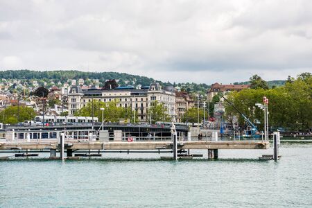 Cruise ship dock at the Lake of Zurich with background of buldings at the lakeshore in Zurich, Switzerland.のeditorial素材