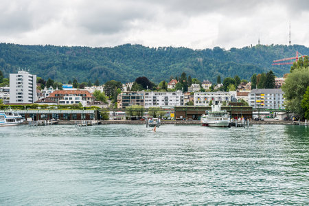 Beautiful buildings on the hills and on the lakeshore of Lake of Zurich, Switzerland.の写真素材