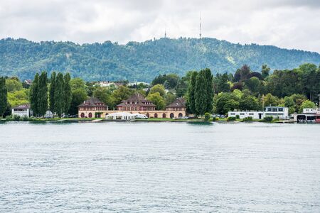 Beautiful buildings on the hills and on the lakeshore of Lake of Zurich, Switzerland.のeditorial素材