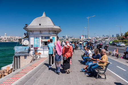 People walking at the Corniche park at Uskudar, Istanbul, Turkey, on the Anatolian shore of the Bosphorus. near the Maiden's Tower, also known as Leander's Towerのeditorial素材