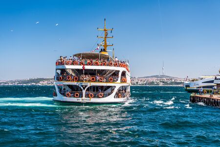 A tourists cruise ship sailing on the Bosphorus Strait of Istanbul of Turkey, part of the continental boundary between Europe and Asiaのeditorial素材