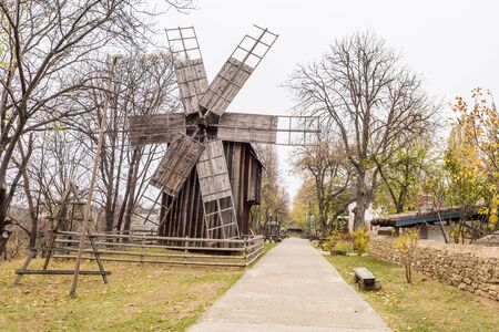 Authentic old wooden windmill from all over Romania in Dimitrie Gusti National Village Museum, an open-air ethnographic museum located in the King Michael I Park, showcasing traditional Romanian village lifeのeditorial素材