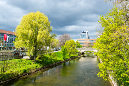 Cityscape of Hannover City with a river and buildings and green trees in April in Germany.のeditorial素材