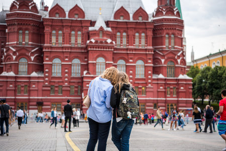 Two females tourist in front of the State of Historic Museum next to the Red Square and Manege Square in Moscow, Russiaのeditorial素材