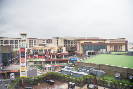 Aerial view of a large shopping mall in a rainy day in Hangzhou, Zhejiang, China.のeditorial素材