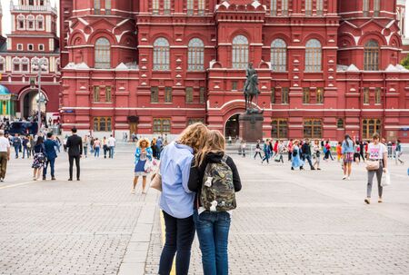 Two females tourist in front of the State of Historic Museum next to the Red Square and Manege Square in Moscow, Russiaのeditorial素材