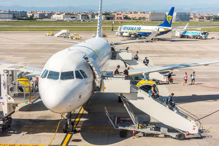 Aircraft of the Vueling airlines stopped at the apron of Naples international airport Capodichino, Italyのeditorial素材