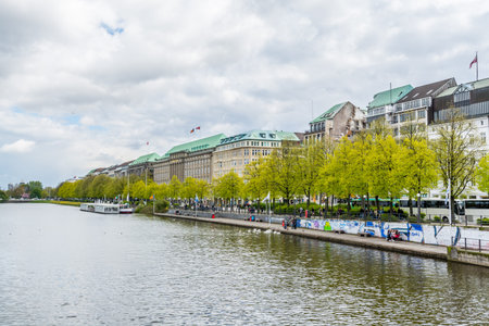 Beautiful lake view of Alster Lake with cloudy sky in Hamburg, Germany.