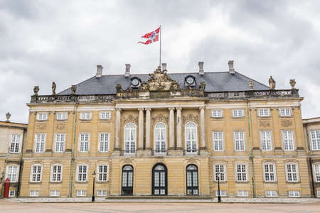Classical palace facades with rococo interiors of the Amalienborg, the home of the Danish royal family, and is located in Copenhagen, Denmark.のeditorial素材