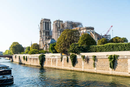 Reconstruction of Notre-Dame de Paris after the big fire, a medieval Catholic cathedral on the Ile de la Cite in the 4th arrondissement of Paris, France.のeditorial素材