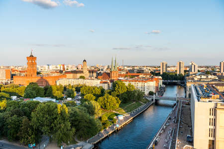 Cityscape of downtown of Berlin with the Red Town Hall and  tower of St. Nicholas' Church under sunset. Aerial view from Berlin Cathedral.のeditorial素材