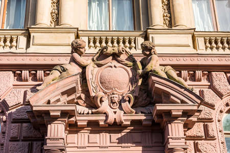 Statue on the wall of an old building in the old town of St. Petersburg, Russiaのeditorial素材