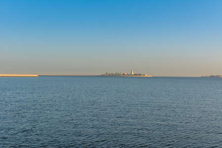 Blue sea and island with blue sky in the morning at the corniche park in Dammam, Kingdom of Saudi Arabiaの写真素材