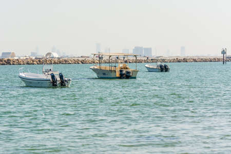 Fishing boat floating at the sea at the corniche park, Dammam, Saudi Arabiaのeditorial素材