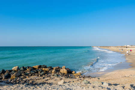 Waves flushing the beach at Ras Al Khaimah, UAEの写真素材
