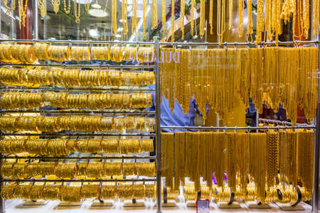 Golden jewelry at the gold street, also called Gold souk, in the city of Dubai, UAEの写真素材