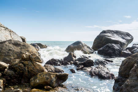 Seascape of waves splashing the stones in the rocky coastline of Yangxi, Yangjiang of China