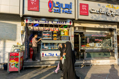 Street view with fruit juice shop in Tehran, Iran.