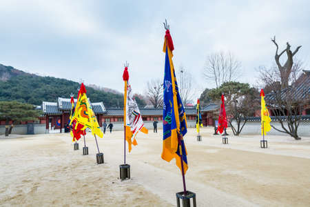 Colorful flags at the Hwaseong Haenggung Palace against cloudy sky in Suwon South Korea, the largest one of where the king Jeongjo and royal family retreated to during a warのeditorial素材