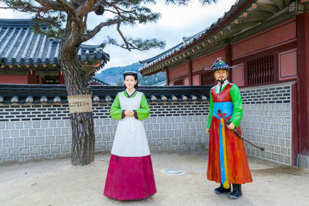 Mannequins dressing traditional clothes and working in the Hwaseong Haenggung Palace located in...