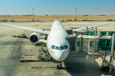 Airplane of Emirates airlines at the boarding gate of Queen Alia International Airport (QAIA) in...