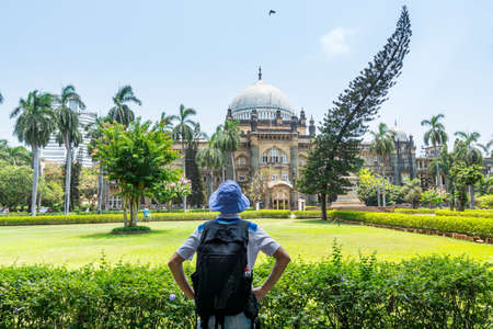 A Chinese male tourist in the Chhatrapati Shivaji Maharaj Vastu Sangrahalaya, formerly The Prince of Wales Museum, the main museum in Mumbai, Maharashtra, India.のeditorial素材