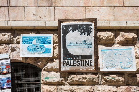 Street view with Palestine pictures hanging on the wall in Lion's street of Muslim quarter in the old city of Jerusalem, Israel.のeditorial素材